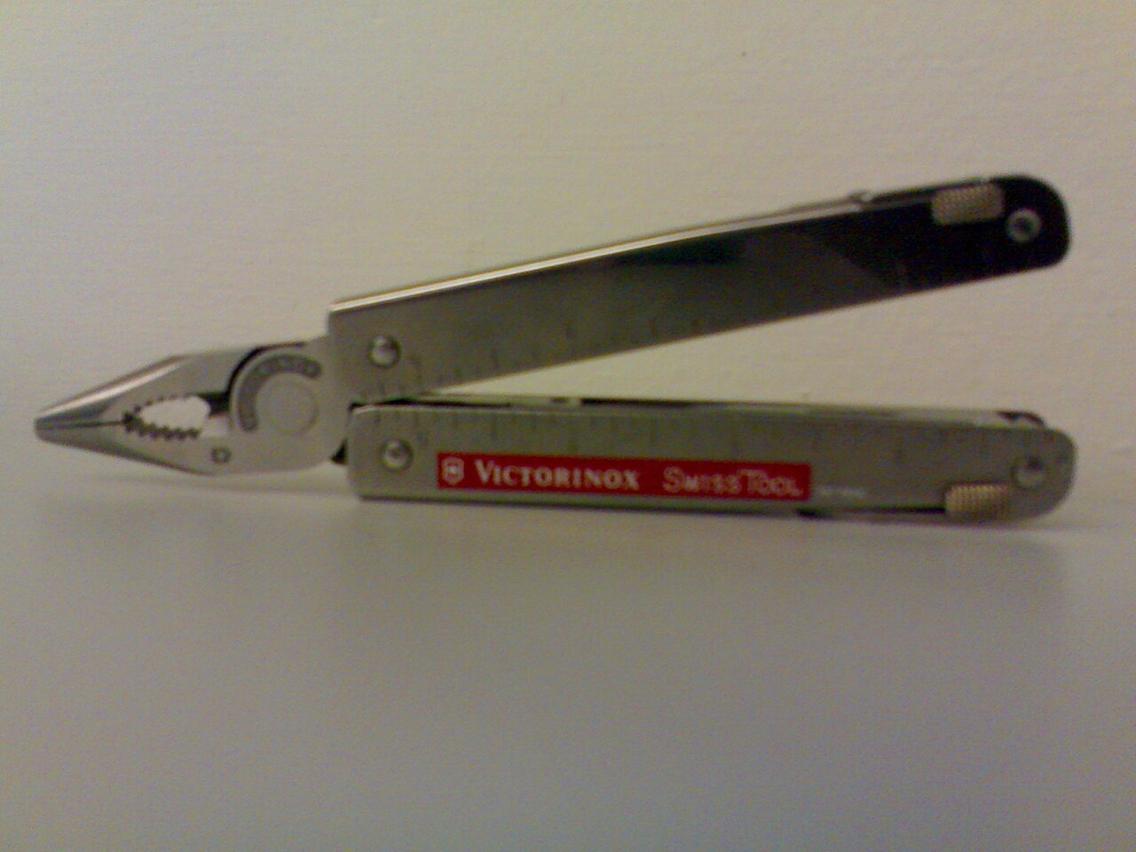 Victorinox Swiss Tool classic silver multitool with pliers opened
