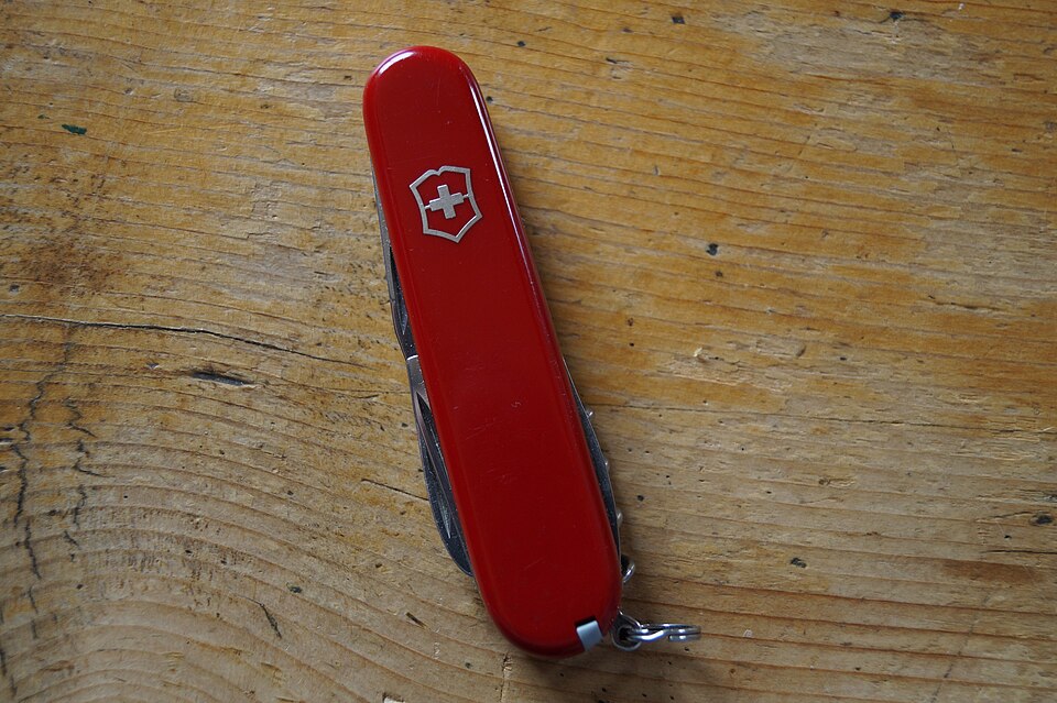 Victorinox Spartan red Swiss Army knife closed on wooden surface