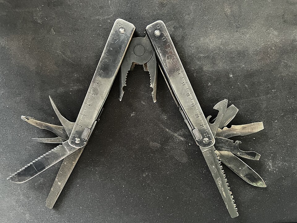 Victorinox Swiss Tool BS black-oxide multitool with pliers and tools opened