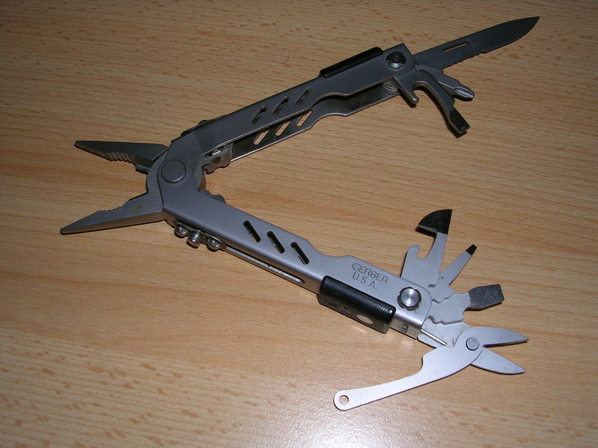 Gerber MP400 Compact Sport multitool opened with its pliers and implements visible