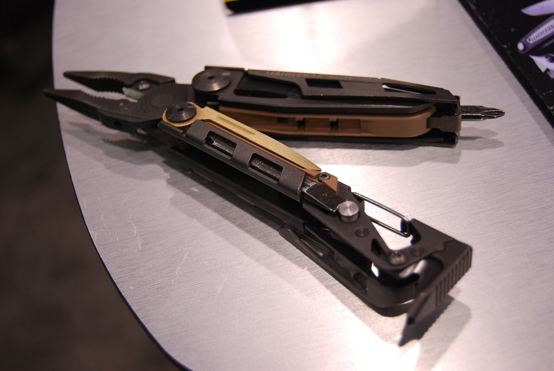 Black Leatherman MUT multitool opened to show pliers, exact model photograph