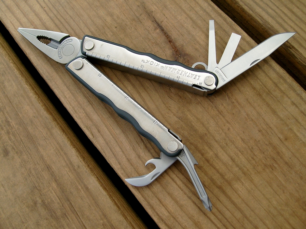 Leatherman Kick stainless multitool with Zytel grip inserts, opened pliers, blade and screwdrivers