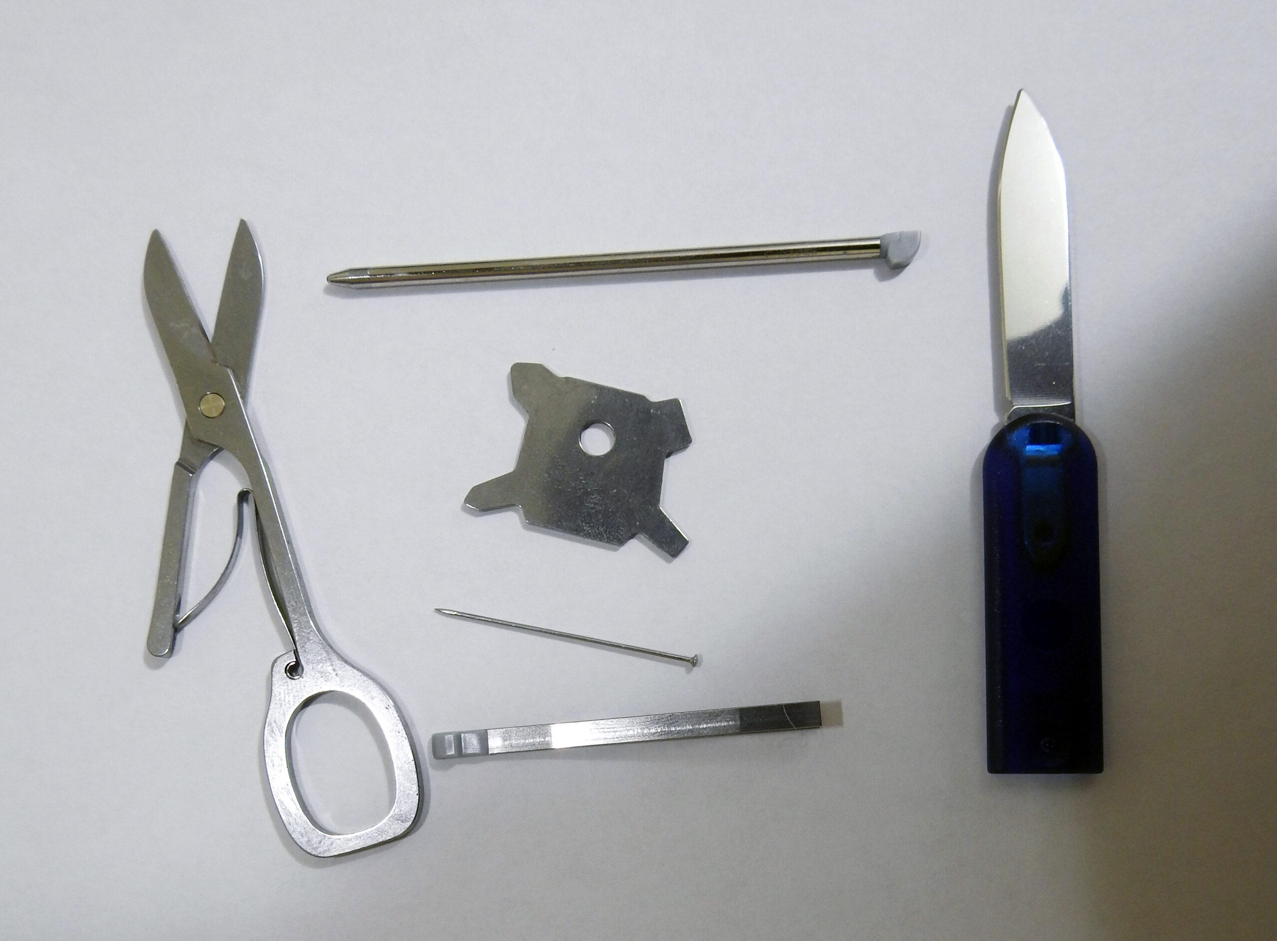 Victorinox SwissCard Lite wallet tool with its removable tools laid out